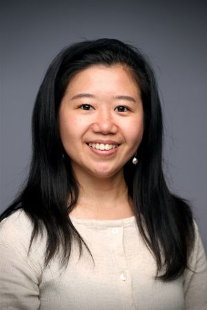 en person som smiler til kameraet