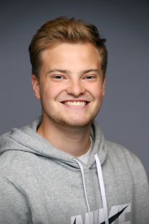 a man smiling for the camera